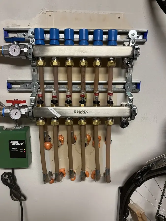 Plumber performing Gas Line Installation at a residential property in Garden City